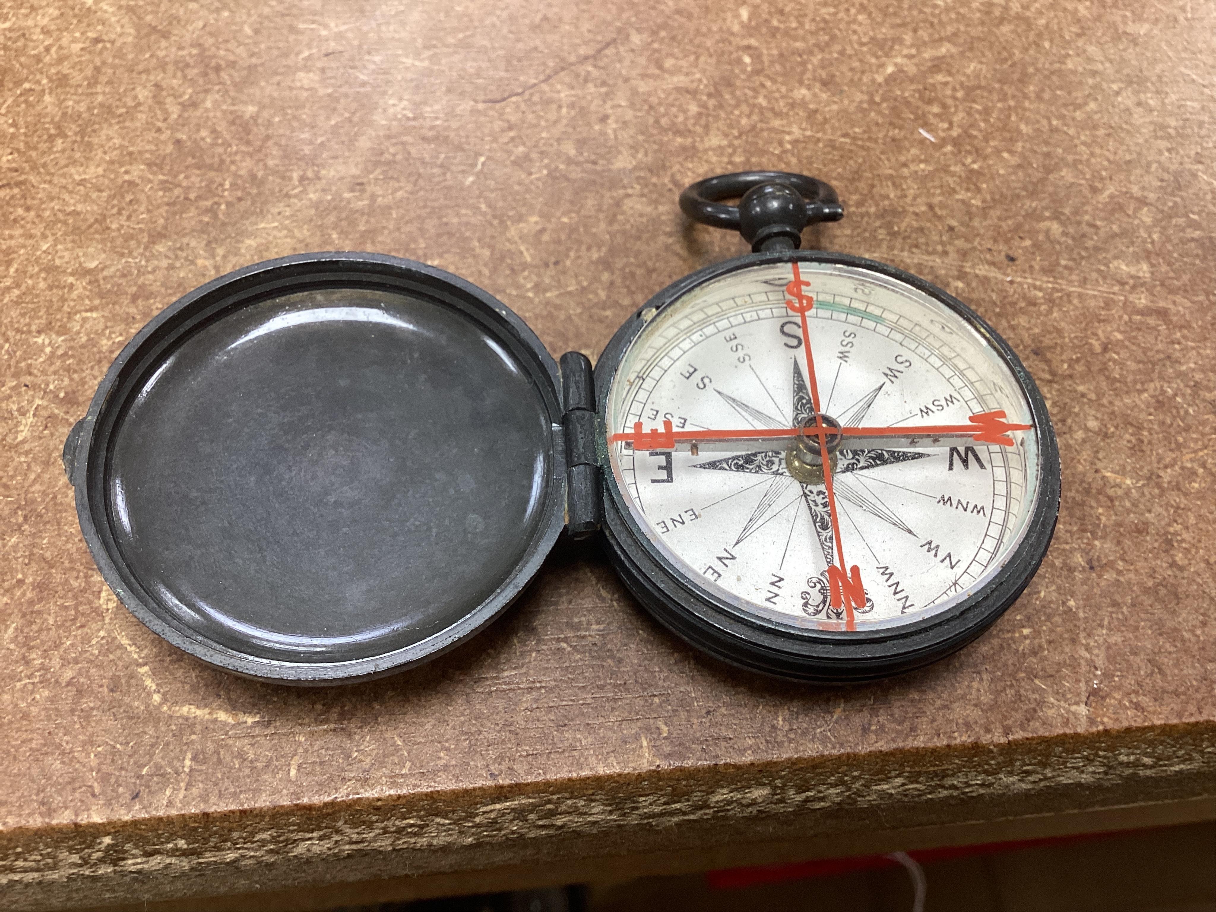 Two pocket damp detectors, a pocket barometer, and a compass, three with original leather cases. Condition - fair
